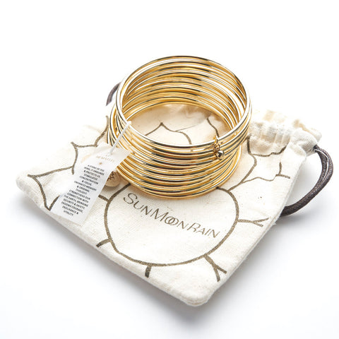 Yellow Gold bangles with a Hematite bead Healing Bracelet (set of 10)